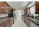 Modern kitchen with stainless steel appliances and granite counters at 2251 Jessie Harbor Dr # 2101, Osprey, FL 34229