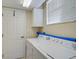 Laundry room with washer, dryer, and storage at 2251 Jessie Harbor Dr # 2101, Osprey, FL 34229