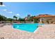 Inviting community pool with lounge chairs and brick patio at 2251 Jessie Harbor Dr # 2101, Osprey, FL 34229