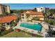 Community pool with lounge chairs and patio area at 2251 Jessie Harbor Dr # 2101, Osprey, FL 34229