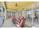 Spacious screened balcony with seating area at 2251 Jessie Harbor Dr # 2101, Osprey, FL 34229