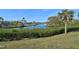 Scenic canal view with lush vegetation and waterfront homes at 2251 Jessie Harbor Dr # 2101, Osprey, FL 34229