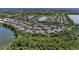 Aerial view of community near a lake and lush green areas at 227 Cape Harbour Loop # 103, Bradenton, FL 34212