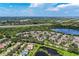 Community aerial view showcasing lakefront location and townhomes at 227 Cape Harbour Loop # 103, Bradenton, FL 34212