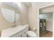 Clean bathroom with white vanity and circular mirror at 227 Cape Harbour Loop # 103, Bradenton, FL 34212