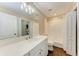 Bathroom boasts white tiled shower, vanity, and dark wood-look floors at 227 Cape Harbour Loop # 103, Bradenton, FL 34212