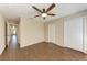 Bright bedroom with ceiling fan and access to hallway at 227 Cape Harbour Loop # 103, Bradenton, FL 34212