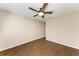 Spacious bedroom with dark wood-look tile floors and ceiling fan at 227 Cape Harbour Loop # 103, Bradenton, FL 34212