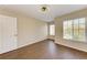 Well-lit bedroom with wood-look floors and large window at 227 Cape Harbour Loop # 103, Bradenton, FL 34212