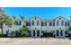 Front view of a three-unit townhouse building with parking at 227 Cape Harbour Loop # 103, Bradenton, FL 34212