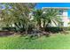 Landscaped yard with lush greenery and two story home at 227 Cape Harbour Loop # 103, Bradenton, FL 34212