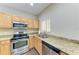 Kitchen boasts granite countertops and stainless steel appliances at 227 Cape Harbour Loop # 103, Bradenton, FL 34212