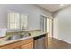 Kitchen features a double sink, granite counters & stainless steel appliances at 227 Cape Harbour Loop # 103, Bradenton, FL 34212