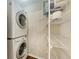 Laundry room with washer, dryer, and ample storage shelving at 227 Cape Harbour Loop # 103, Bradenton, FL 34212
