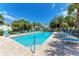 Inviting community pool with lounge chairs and lush landscaping at 227 Cape Harbour Loop # 103, Bradenton, FL 34212