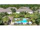 Aerial view of community pool with surrounding lounge chairs at 227 Cape Harbour Loop # 103, Bradenton, FL 34212