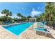 Inviting community pool with a gazebo and plenty of lounge chairs at 227 Cape Harbour Loop # 103, Bradenton, FL 34212