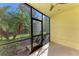 Spacious screened patio with lush tropical views at 227 Cape Harbour Loop # 103, Bradenton, FL 34212