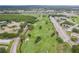 Aerial view of community with golf course and buildings at 2435 Sumatran Way # 35, Clearwater, FL 33763
