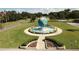 Aerial view of community with a large globe centerpiece at 2435 Sumatran Way # 35, Clearwater, FL 33763