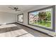 Bright bedroom with hardwood floors, ceiling fan, and large windows offering a exterior view at 2435 Sumatran Way # 35, Clearwater, FL 33763
