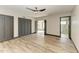 Large bedroom with wood flooring, modern ceiling fan, stylish doors and baseboards at 2435 Sumatran Way # 35, Clearwater, FL 33763