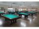 Well-lit billiards room with multiple pool tables at 2435 Sumatran Way # 35, Clearwater, FL 33763
