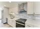 Close up of updated kitchen featuring marble backsplash, stainless steel appliances and modern cabinetry at 2435 Sumatran Way # 35, Clearwater, FL 33763