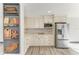 Modern kitchen design with stainless steel refrigerator and marble countertops with decorative shelving at 2435 Sumatran Way # 35, Clearwater, FL 33763