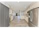 Open-concept kitchen with stainless steel appliances, wood flooring, and ample cabinet space at 2435 Sumatran Way # 35, Clearwater, FL 33763