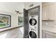 Bright laundry area with a stacked washer and dryer for space-saving efficiency at 2435 Sumatran Way # 35, Clearwater, FL 33763