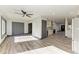 Open-concept kitchen featuring hardwood floors, white cabinets, and modern appliances at 2435 Sumatran Way # 35, Clearwater, FL 33763