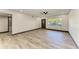 Bright, open living room featuring modern flooring, recessed lighting, and a ceiling fan at 2435 Sumatran Way # 35, Clearwater, FL 33763