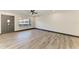 Bright, open living room featuring modern flooring, recessed lighting, and a ceiling fan at 2435 Sumatran Way # 35, Clearwater, FL 33763
