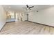 Bright, open living room featuring modern flooring, recessed lighting, and a ceiling fan at 2435 Sumatran Way # 35, Clearwater, FL 33763