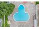 Community pool with surrounding lounge area at 2435 Sumatran Way # 35, Clearwater, FL 33763