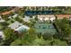 Community features including tennis courts, pool, and residential buildings at 3780 82Nd Avenue E Cir # 106, Sarasota, FL 34243