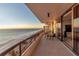 Spacious balcony overlooking the ocean with seating at 415 L Ambiance Dr # A801, Longboat Key, FL 34228