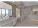 Spa-like bathroom featuring a freestanding tub and glass shower at 415 L Ambiance Dr # A801, Longboat Key, FL 34228