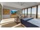 Serene bedroom with ocean views and large TV at 415 L Ambiance Dr # A801, Longboat Key, FL 34228
