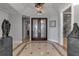 Elegant entryway with marble floors and double doors at 415 L Ambiance Dr # A801, Longboat Key, FL 34228