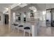 Modern kitchen with a large marble island and breakfast bar at 415 L Ambiance Dr # A801, Longboat Key, FL 34228