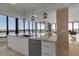 Sleek white kitchen with marble countertops and ocean views at 415 L Ambiance Dr # A801, Longboat Key, FL 34228