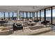 Spacious living room with ocean views and luxurious furnishings at 415 L Ambiance Dr # A801, Longboat Key, FL 34228