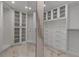 Large walk-in closet, custom built-ins, and mirrored doors at 415 L Ambiance Dr # A801, Longboat Key, FL 34228