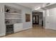 Modern wet bar with wine cooler and shelving at 415 L Ambiance Dr # A801, Longboat Key, FL 34228