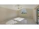 Bright bedroom with tile floor and large window at 42 Marker Rd, Rotonda West, FL 33947