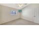 Bright bedroom with carpet floors and a view at 42 Marker Rd, Rotonda West, FL 33947