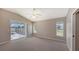 Spacious bedroom with pool access and carpet floors at 42 Marker Rd, Rotonda West, FL 33947