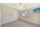 Cozy bedroom with carpet floors and a view at 42 Marker Rd, Rotonda West, FL 33947